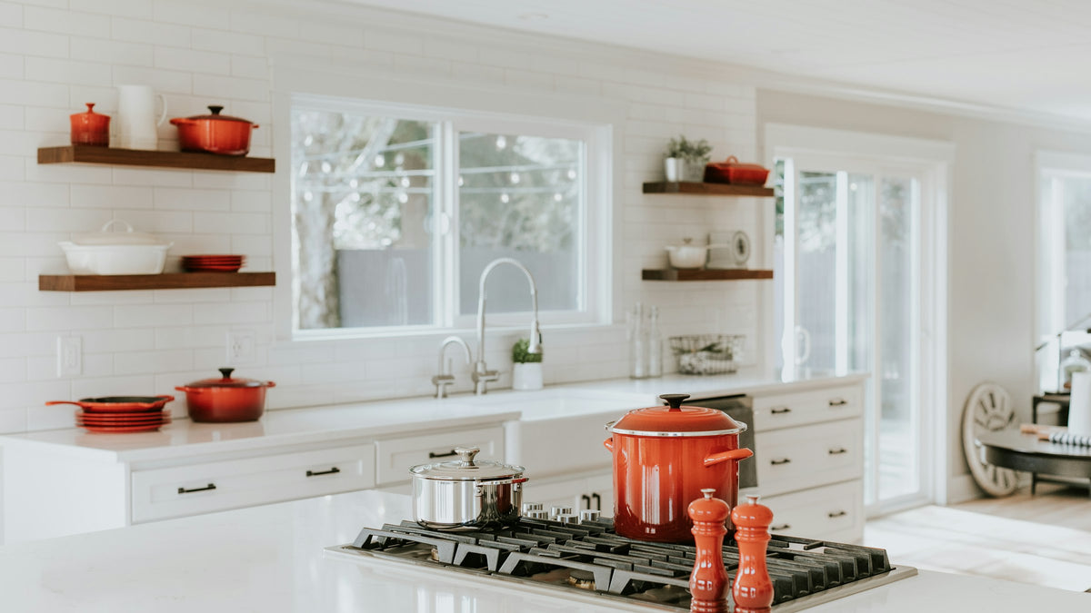 Peppermill beside cooking pots on a kitchen counter